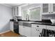 Beautifully updated kitchen featuring white cabinetry, stainless steel appliances, and modern fixtures at 533 Patterson Rd, Columbus, IN 47203