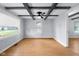 Well-lit living room with wood-look floors and custom ceiling beams offers a comfortable and inviting space at 533 Patterson Rd, Columbus, IN 47203