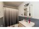 Bathroom featuring vanity, medicine cabinet, and shower with curtain at 5719 N Frontage Rd, Fairland, IN 46126