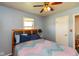 Comfortable bedroom with ceiling fan and neutral colored walls at 5719 N Frontage Rd, Fairland, IN 46126