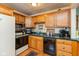 Functional kitchen with stainless steel appliances and wood cabinets at 5719 N Frontage Rd, Fairland, IN 46126