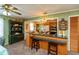 Eat-in kitchen with wood cabinets, a breakfast bar, and unique decor elements at 5719 N Frontage Rd, Fairland, IN 46126