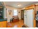Kitchen features wood cabinets, tile floors, and natural light at 5719 N Frontage Rd, Fairland, IN 46126