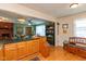 Eat-in kitchen with wood cabinets, island, and decorative elements at 5719 N Frontage Rd, Fairland, IN 46126