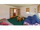 Bright living room with French doors, comfortable seating, and natural light at 5719 N Frontage Rd, Fairland, IN 46126