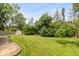Well-maintained backyard with lush green lawn and storage shed at 5802 Rymark Ct, Indianapolis, IN 46250