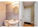 Bathroom featuring a vanity, toilet, and well-lit with a modern design at 5802 Rymark Ct, Indianapolis, IN 46250