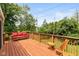 Large wooden deck with outdoor seating and backyard views at 5802 Rymark Ct, Indianapolis, IN 46250
