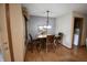 Cozy dining room features a wood table with seating for four under a hanging light fixture at 5943 Red Maple Dr, Indianapolis, IN 46237