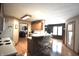 Bright kitchen features a breakfast bar with seating, modern appliances, and light wood cabinets at 5943 Red Maple Dr, Indianapolis, IN 46237