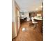 Open-concept kitchen with a breakfast bar, wood cabinets, and adjacent dining area at 5943 Red Maple Dr, Indianapolis, IN 46237