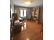 Home office with hardwood floors, natural light, and built-in shelving at 5943 Red Maple Dr, Indianapolis, IN 46237
