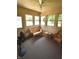 Charming sunroom filled with natural light and wicker furniture, perfect for relaxation at 5943 Red Maple Dr, Indianapolis, IN 46237