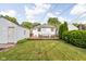 A beautiful backyard with a well-kept lawn and a wooden deck, ideal for outdoor entertaining and relaxation at 6045 Crittenden Ave, Indianapolis, IN 46220