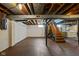 Unfinished basement with exposed ceiling and painted walls, ready for customization at 6045 Crittenden Ave, Indianapolis, IN 46220