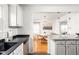 Bright kitchen seamlessly connects to the dining area, featuring modern appliances and stylish finishes at 6045 Crittenden Ave, Indianapolis, IN 46220