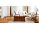 Comfortable living room with hardwood floors, neutral colors, and a vintage-style trunk as a coffee table at 6045 Crittenden Ave, Indianapolis, IN 46220