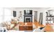 Bright and inviting living room featuring a fireplace, built-in shelves, and hardwood floors at 6045 Crittenden Ave, Indianapolis, IN 46220