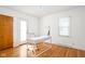 Bright office space with hardwood floors, natural light, and a modern white desk at 6045 Crittenden Ave, Indianapolis, IN 46220