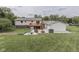A serene backyard featuring a fire pit and a wooden deck, perfect for outdoor relaxation at 617 Echo Bend Blvd, Greenwood, IN 46142