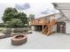 Charming backyard with a brick fire pit and a wooden deck for entertaining guests at 617 Echo Bend Blvd, Greenwood, IN 46142