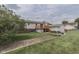 Spacious backyard featuring a deck, storage shed, and well-maintained lawn at 617 Echo Bend Blvd, Greenwood, IN 46142