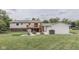 Large backyard with a deck, fire pit, and storage shed at 617 Echo Bend Blvd, Greenwood, IN 46142
