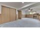 Spacious basement featuring wood-paneling, neutral carpet, and a large closet at 617 Echo Bend Blvd, Greenwood, IN 46142