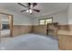 Finished basement features a ceiling fan, paneled walls and a built-in desk at 617 Echo Bend Blvd, Greenwood, IN 46142