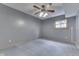 Cozy bedroom with a ceiling fan and neutral carpet and walls at 617 Echo Bend Blvd, Greenwood, IN 46142