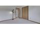 Bedroom with plush carpeting, white walls, wood trim, and closet at 617 Echo Bend Blvd, Greenwood, IN 46142