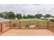 Enjoy the view from this spacious wooden deck with serene backyard at 617 Echo Bend Blvd, Greenwood, IN 46142