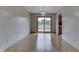 Open dining area with wood floors and sliding glass door leading to a deck at 617 Echo Bend Blvd, Greenwood, IN 46142