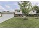 Inviting home featuring a neatly kept lawn, beautiful landscaping, and a convenient two-car garage at 617 Echo Bend Blvd, Greenwood, IN 46142