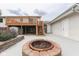 Beautiful backyard patio with a fire pit for cozy outdoor gatherings and relaxing evenings at 617 Echo Bend Blvd, Greenwood, IN 46142