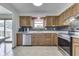 Kitchen features stainless steel appliances, oak cabinets and gray subway tile backsplash at 617 Echo Bend Blvd, Greenwood, IN 46142