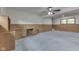 Well-lit carpeted living room features built-in desk and shelves at 617 Echo Bend Blvd, Greenwood, IN 46142