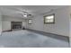 Spacious carpeted living room with cozy fireplace and a ceiling fan for added comfort at 617 Echo Bend Blvd, Greenwood, IN 46142