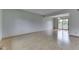 Spacious room with laminate floors, featuring a sliding glass door to the deck, perfect for entertaining at 617 Echo Bend Blvd, Greenwood, IN 46142