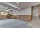 Large carpeted living room features built-in desk and shelves, and stairs to the upper level at 617 Echo Bend Blvd, Greenwood, IN 46142