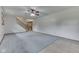 Inviting living room with stairs, neutral carpet, and a ceiling fan at 617 Echo Bend Blvd, Greenwood, IN 46142