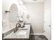 Bathroom featuring double sinks, granite countertops, modern fixtures, and a dark tile floor at 624 E Walnut St # 48, Indianapolis, IN 46204