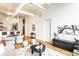 Bright open-concept living and dining area featuring hardwood floors and stylish decor at 624 E Walnut St # 48, Indianapolis, IN 46204