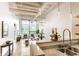 Open-concept living space with a view of kitchen, showcasing the flow of the home at 624 E Walnut St # 48, Indianapolis, IN 46204