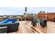 Inviting rooftop deck featuring comfortable seating, dining space, and city views at 624 E Walnut St # 48, Indianapolis, IN 46204