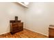 An empty room with vintage hardwood flooring and vintage cabinets at 624 E Walnut St # 48, Indianapolis, IN 46204