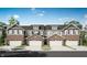 Charming townhome complex with brick accents, garages, and well-manicured lawns offers comfortable and stylish living at 6659 Halsey St, Zionsville, IN 46077