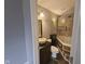 Bathroom with a unique sink bowl, a stylish vanity, and a glass-enclosed shower at 7307 Barnwell Pl, Indianapolis, IN 46217