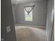 Cozy bedroom with neutral walls and carpeted floor, ready for personalization and relaxation at 7307 Barnwell Pl, Indianapolis, IN 46217