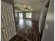 Bright and airy living room with beautiful wood floors, neutral walls, and plenty of natural light at 7307 Barnwell Pl, Indianapolis, IN 46217